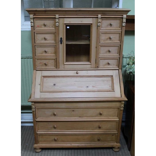 276 - A multi drawer top with central cupboard over fall down front and three full width drawers, 173cm x ... 