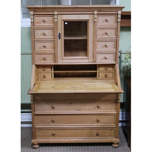 276 - A multi drawer top with central cupboard over fall down front and three full width drawers, 173cm x ... 