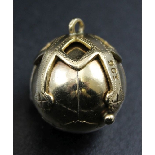 31 - A 9ct gold Masonic orb pendant, opens to reveal six silver gilt pyramids, engraved with symbols, gro... 