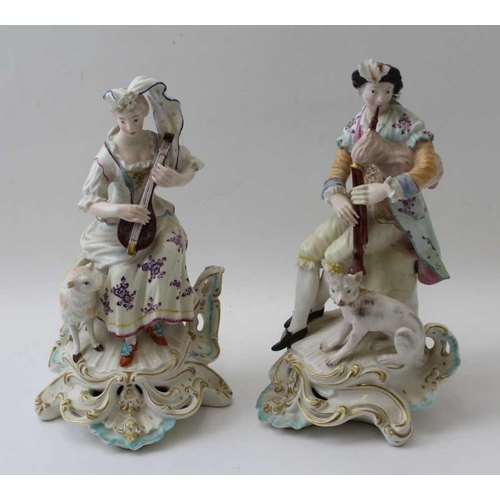 42 - A pair of Derby porcelain figures, a shepherd with his dog & shepherdess with lamb, both playing mus... 