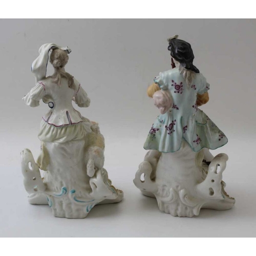 42 - A pair of Derby porcelain figures, a shepherd with his dog & shepherdess with lamb, both playing mus... 