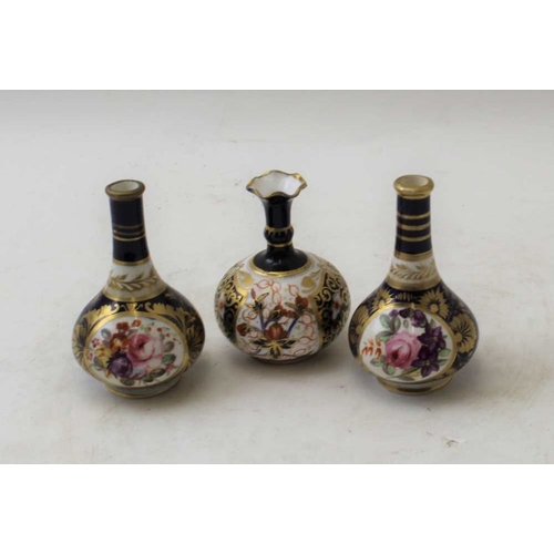 48 - A pair of Royal Crown Derby vases, floral painted and one other similar