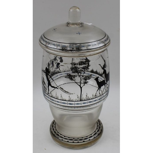 49 - A Bohemian Adolf Beckert glass jar with lid, having silhouette decoration in the round, 23cm high