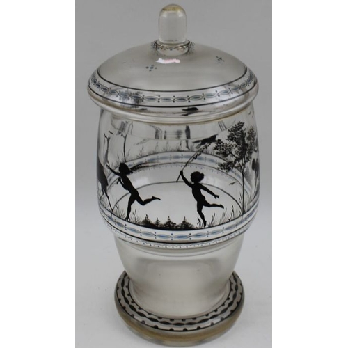 49 - A Bohemian Adolf Beckert glass jar with lid, having silhouette decoration in the round, 23cm high