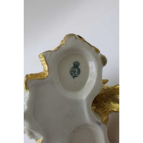 50 - A Worcester porcelain gilded condiment stand, central handle, 11cm high