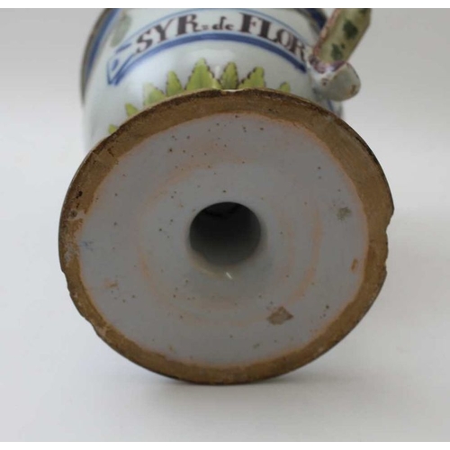 64 - A majollica wet drug jar, painted with swags, inscribed 