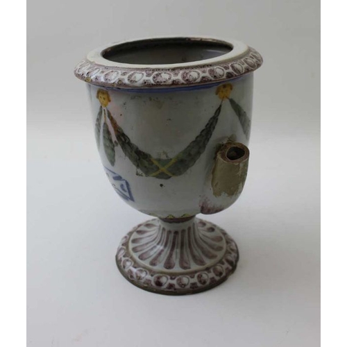 64 - A majollica wet drug jar, painted with swags, inscribed 