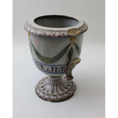 64 - A majollica wet drug jar, painted with swags, inscribed 