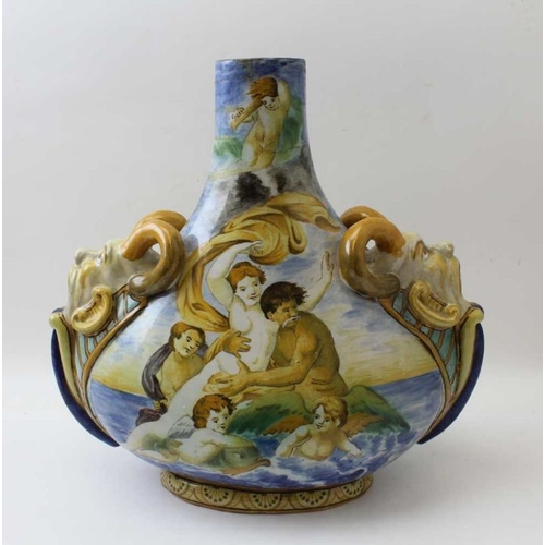 67 - A Continental majolica vase, of tear drop form, having satyr masks to the shoulders, painted with sc... 