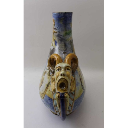 67 - A Continental majolica vase, of tear drop form, having satyr masks to the shoulders, painted with sc... 