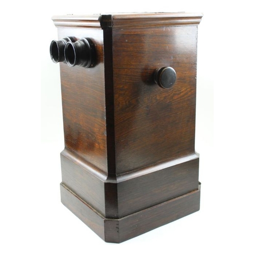 68 - A rosewood cased table top stereoscopic viewer, c.1900, 46cm high, with 50 glass slides