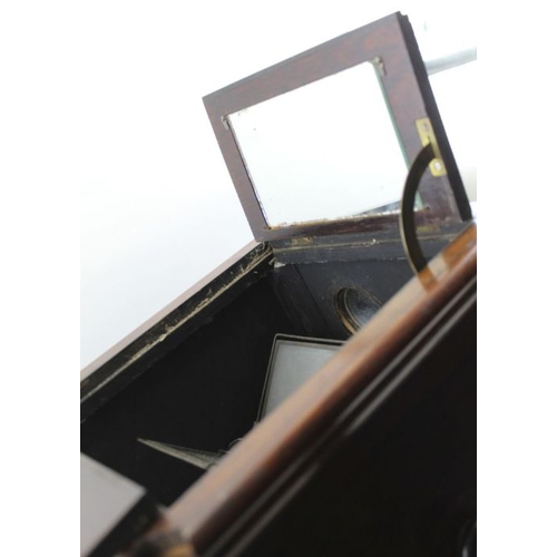 68 - A rosewood cased table top stereoscopic viewer, c.1900, 46cm high, with 50 glass slides