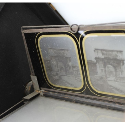 68 - A rosewood cased table top stereoscopic viewer, c.1900, 46cm high, with 50 glass slides