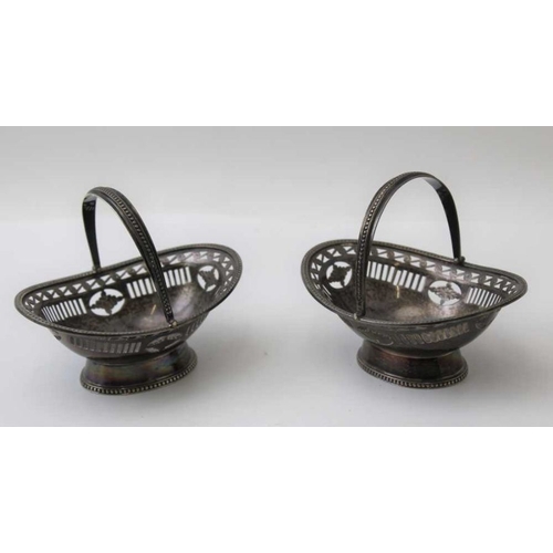 7 - George Nathan and Ridley Hayes, a pair of small silver bon-bon baskets, with swing handles and pierc... 