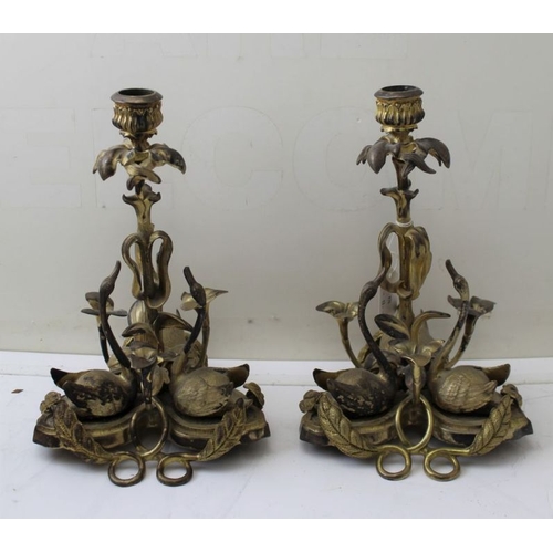 70 - A pair of late 19th century gilded metal swan candlesticks