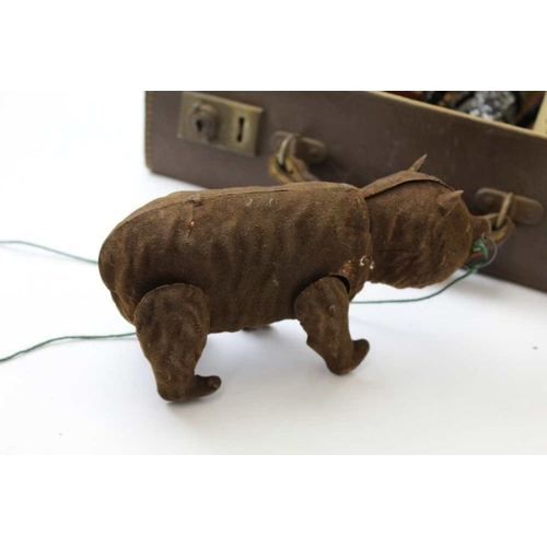 80 - An early 20th century clockwork bear, fabric covered tin plate, 18cm long, together with a painted t... 