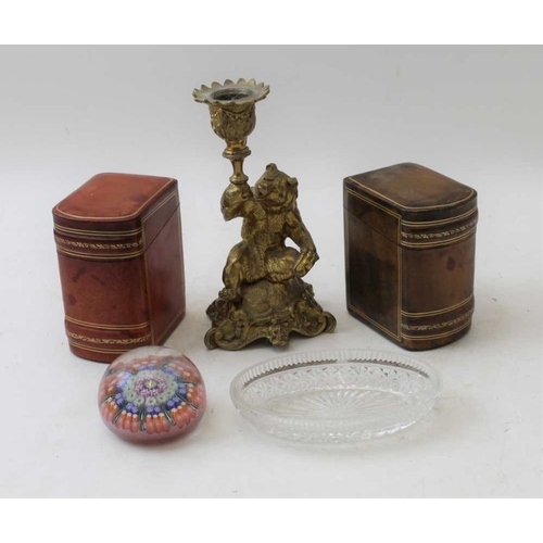 87 - A gilt metal cast bear stem candlestick, two leather book design boxes, paperweight, etc.