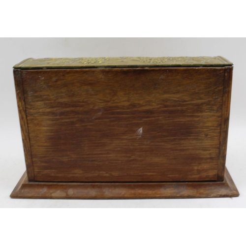 91 - An early 20th century, Art Nouveau, oak desk top stationary casket, with decoratively embossed brass... 