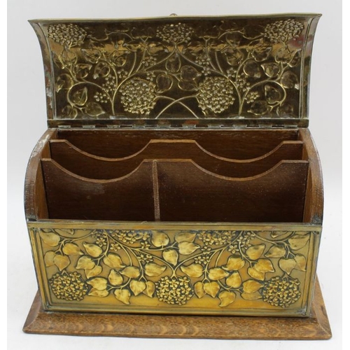 91 - An early 20th century, Art Nouveau, oak desk top stationary casket, with decoratively embossed brass... 