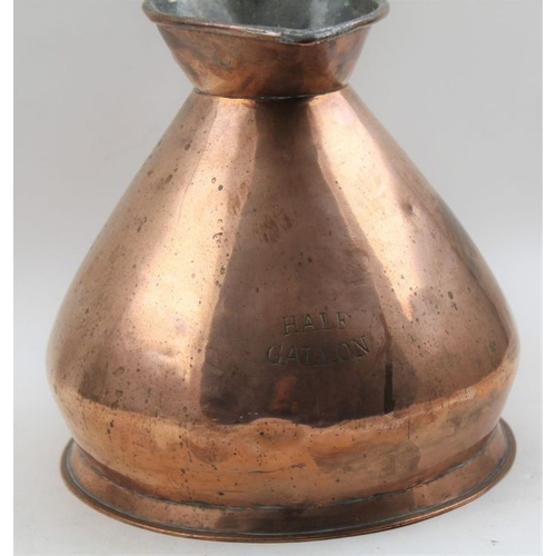 95 - A 19th century copper Half Gallon jug together with a pair of 19th brass candlesticks 14cm high