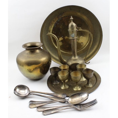 96 - A collection of Middle Eastern brassware, includes a coffee set with pot and cups on tray, together ... 