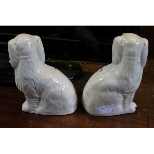 226 - A pair of reproduction Victorian design Staffordshire hearth spaniels.