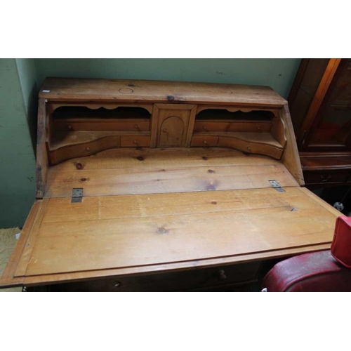 23 - A pine bureau, with four drawer base