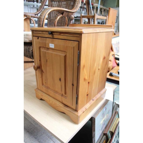 61 - A pine bedside cupboard.