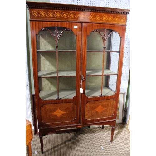 124 - An Edwardian mahogany inlaid display cabinet with two fancy bar glazed doors, opening to reveal upho... 