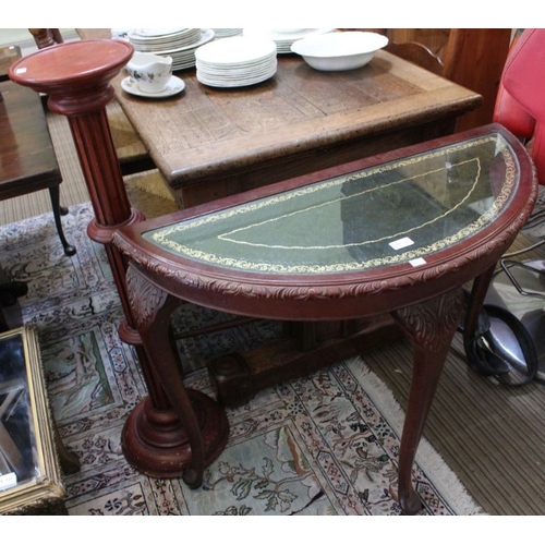 131 - A D-shape hall table, tooled green top, together with a column torchere