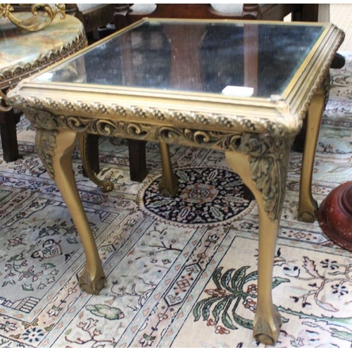 132 - A gilt framed occasional table with a mirror top