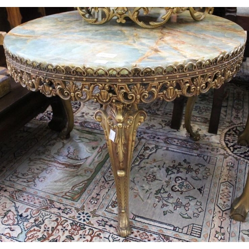 133 - A circular onyx top table, on brass frame base