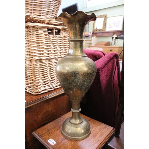 138 - A small carved four legged side table together with a large brass vase