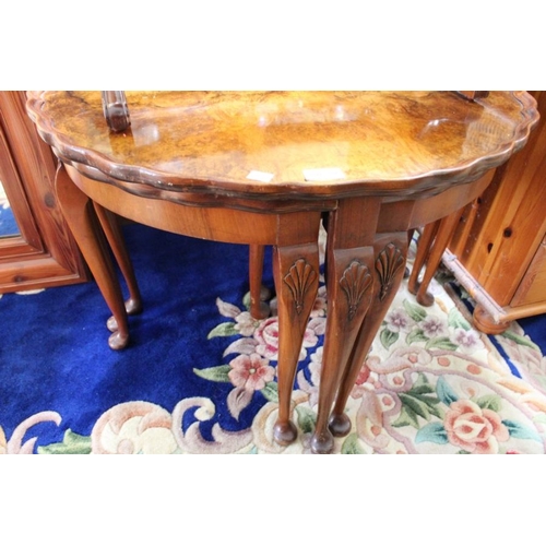 147 - A burr walnut centre table with a quartetto of orphans, 75cm dia x 52cm high