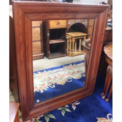 150 - A pine frame wall mirror, plate size; 76cm x 61cm