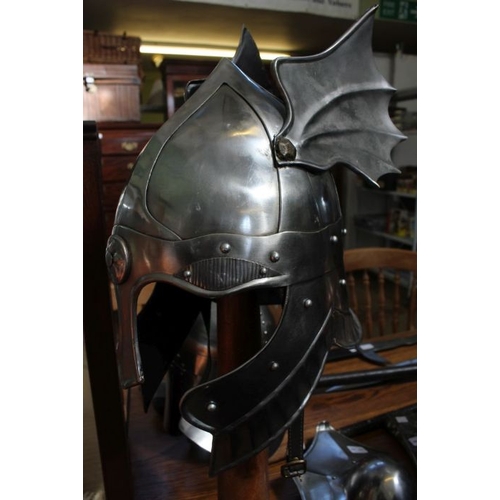 155 - A Helmet with steel wings and a nose piece