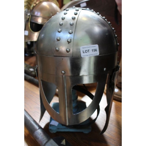 156 - A Helmet with a face guard & ear protectors