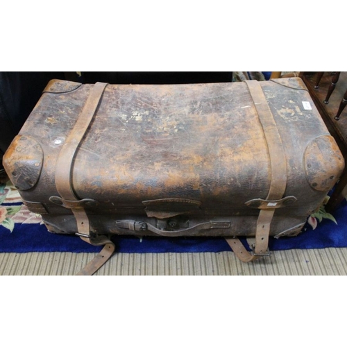 168 - A large leather twin handled travelling trunk, with two straps & lock