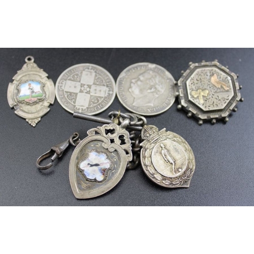 18 - A quantity of silver items, includes sporting fobs, spoons, vesta case, coins, silver mounted cigar ... 