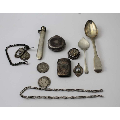 18 - A quantity of silver items, includes sporting fobs, spoons, vesta case, coins, silver mounted cigar ... 