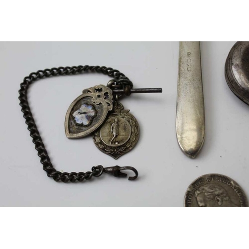 18 - A quantity of silver items, includes sporting fobs, spoons, vesta case, coins, silver mounted cigar ... 