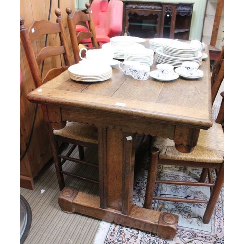 188 - An oak rectangular topped dining table, having chip carved apron supported on twin plain columns, un... 