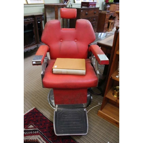 190 - A pair of 1970's stainless steel framed adjustable barbers chairs with red vinyl pads,102cm high at ... 