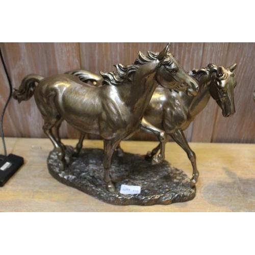 196 - Bronze effect cast resin model of two playful horses, 30.5cm high