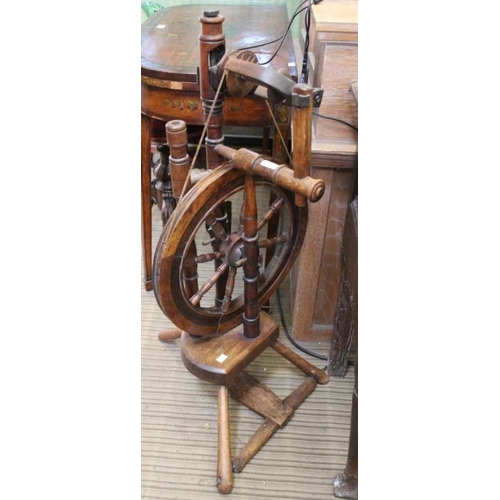 198 - A vintage small wooden spinning wheel