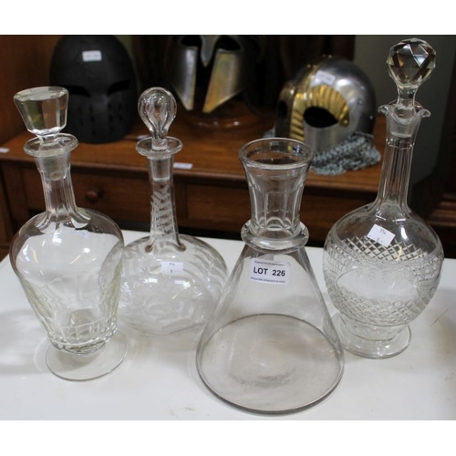 226 - Three decanters with stoppers and a conical carafe