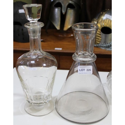 226 - Three decanters with stoppers and a conical carafe