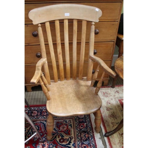 234 - A late 19th century slat backed country kitchen armchair, with solid seat