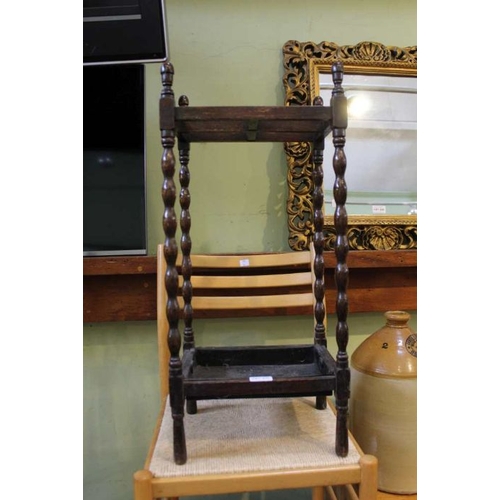 238 - An early 20th century small sized oak framed stick stand, retaining original drip tray, together a m... 