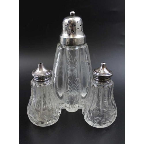 24 - A pair of silver rimmed glass vases, Birmingham 1921, 21cm high, together with a silver topped glass... 